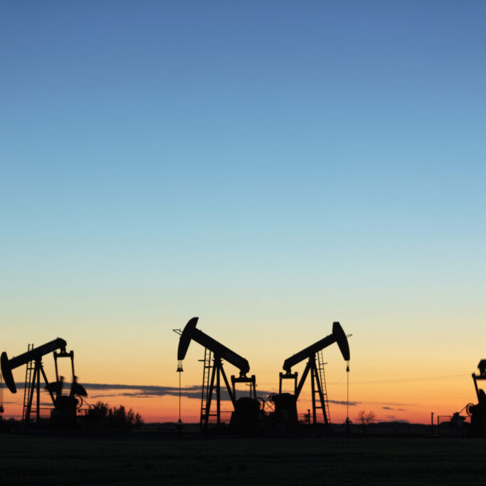 Four pump jacks producing oil, Image taken near the town of Virden, Manitoba. Image taken from a tripod.