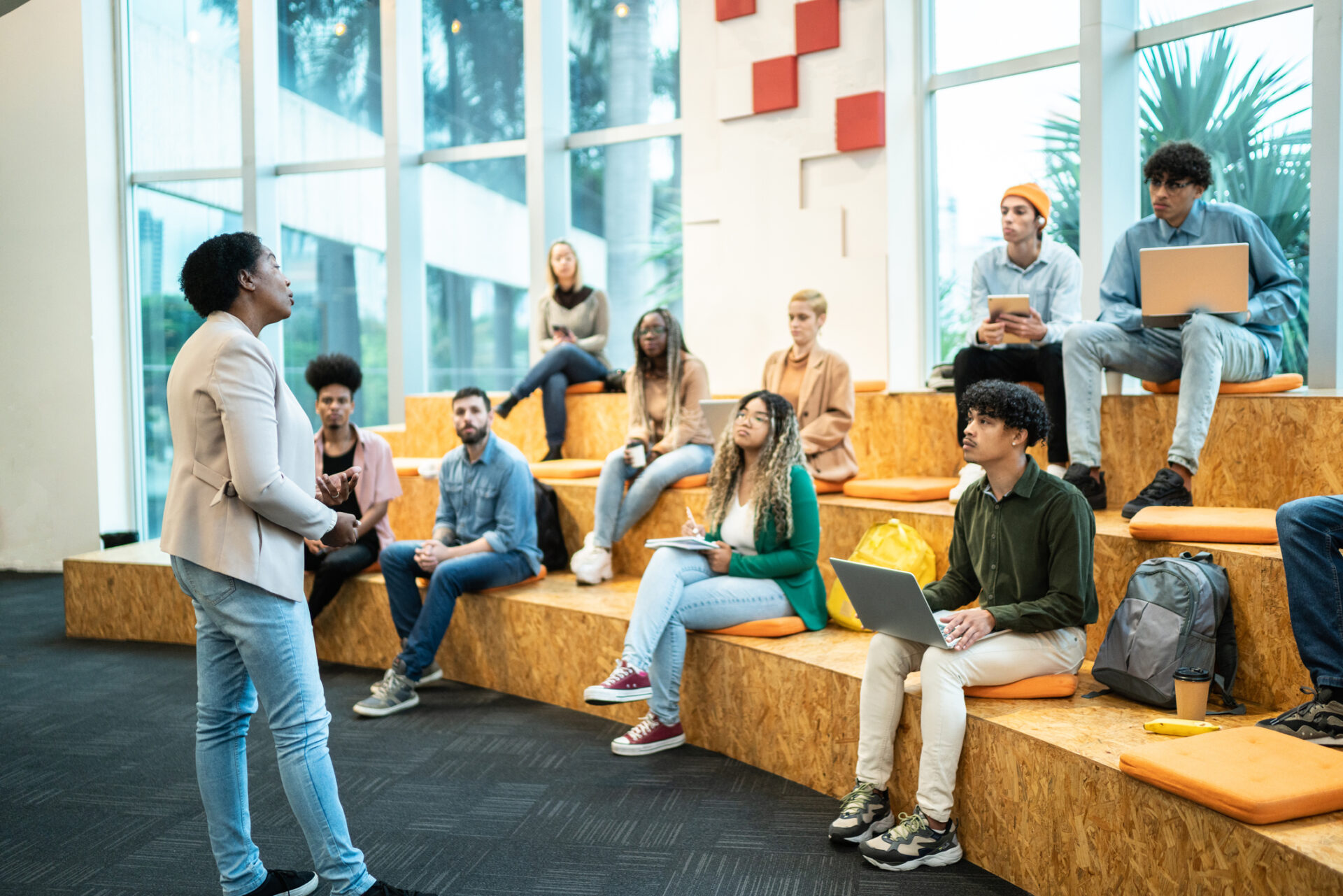 Mature teacher giving lecture to students at the university