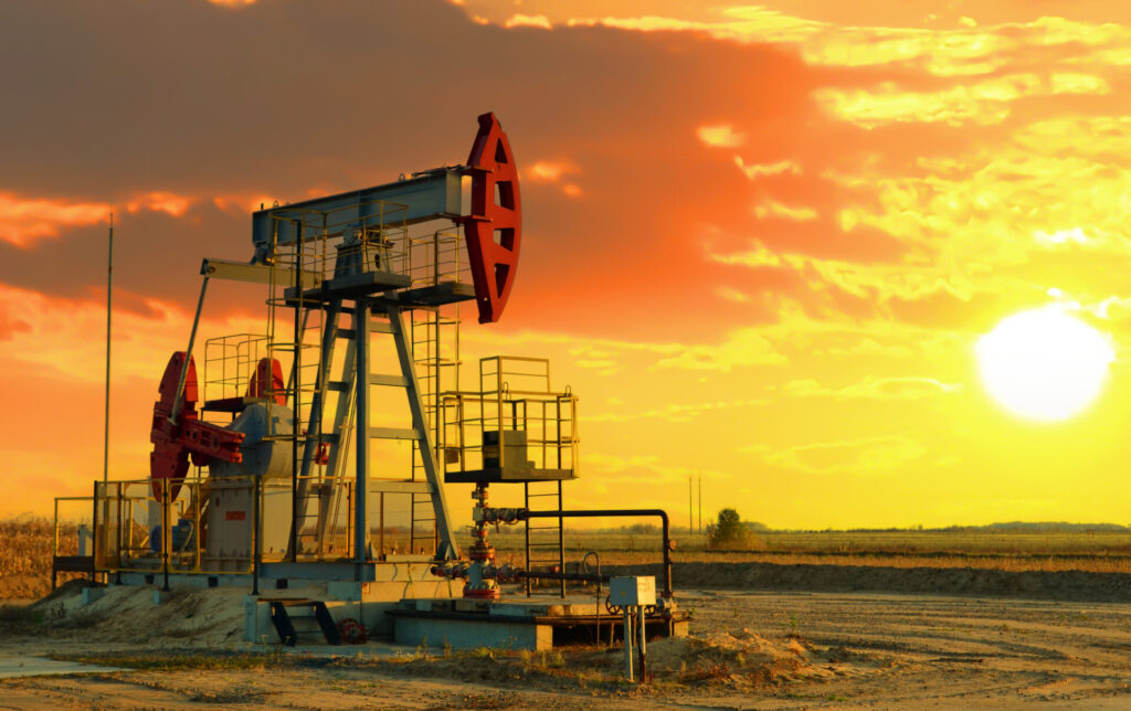 Oil prices on global market. Crude oil Pumpjack on oilfield on sunset. Fossil crude production. Oil drill rig and drilling derrick. Global crude oil Prices, petroleum demand OPEC+. Pump jack, oilfield