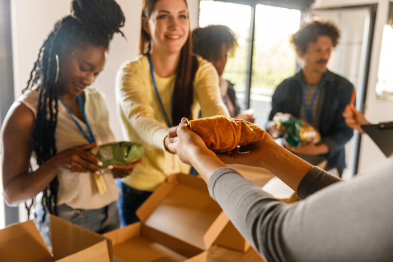 A team of selfless volunteers attentively organizes clothing donations, ensuring that each item is clean and ready to bring warmth to someone's life.