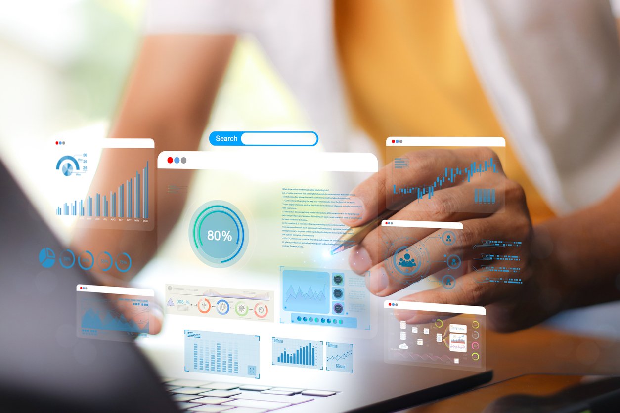 Businessman using computer for development and Analytics Data technology management System for report marketing strategy planning. graph analysis and information on a futuristic virtual screen.